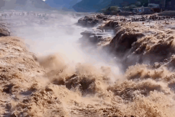 Mesmerizing Golden Waves: Hukou Waterfall Spectacle on Yellow River Mesmerizing_Golden_Waves__Hukou_Waterfall_Spectacle_on_Yellow_River video poster