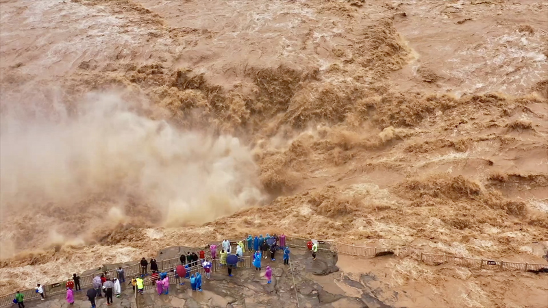 Hukou Waterfall Roars into Golden Cascade at 2,000 m³/s video poster