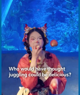 Guangzhou Aquarium Performer's Apple Juggling Goes Viral 🍏 video poster