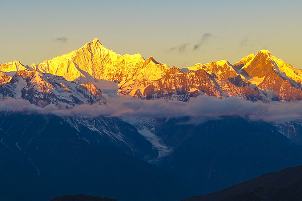 Sunlit_Golden_Peaks__Meili_Snow_Mountain_s_Winter_Glow